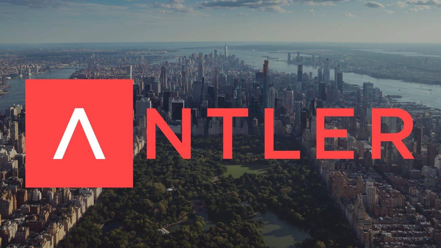 A panoramic view of a city skyline with greenery in the foreground prominently features the logo of Antler, a startup investment firm.