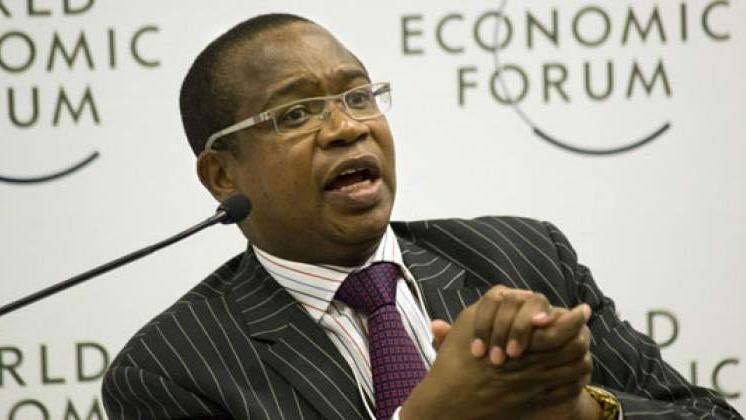 A speaker gestures expressively while discussing topics related to venture capital and startups at a World Economic Forum event.